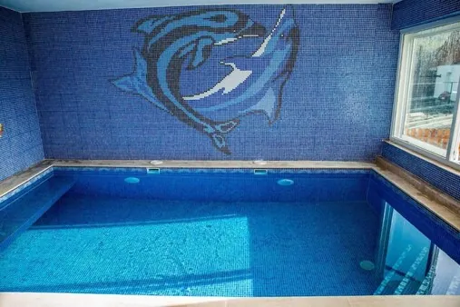 Indoor swimming pool with blue mosaic